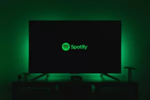 a Spotify logo on a TV