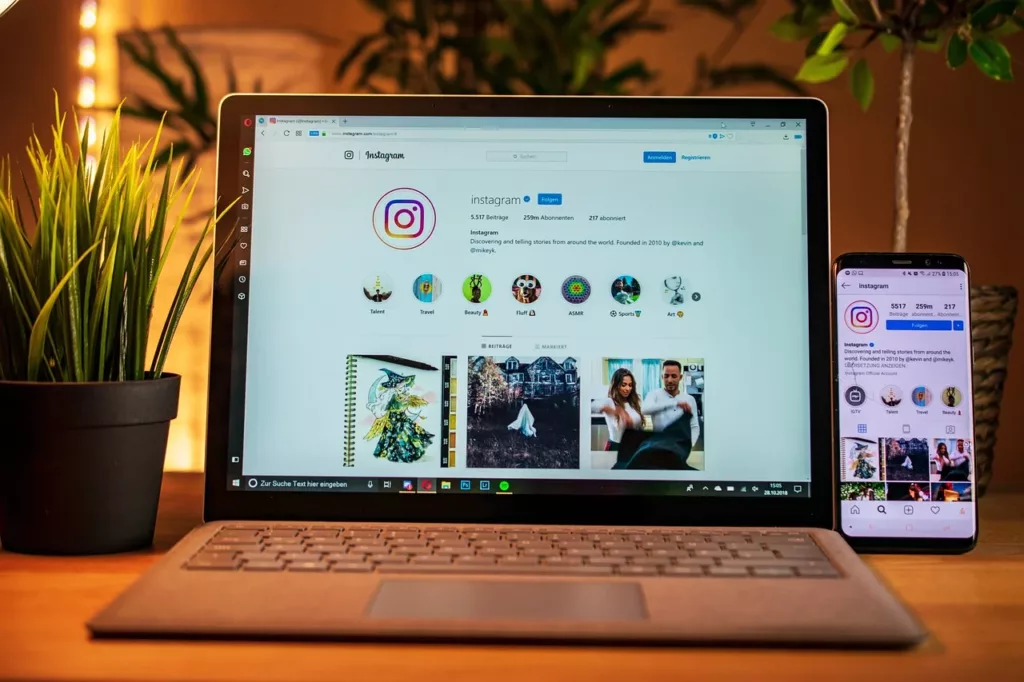 instagram user account opened on laptop and phone