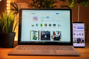 instagram user account opened on laptop and phone