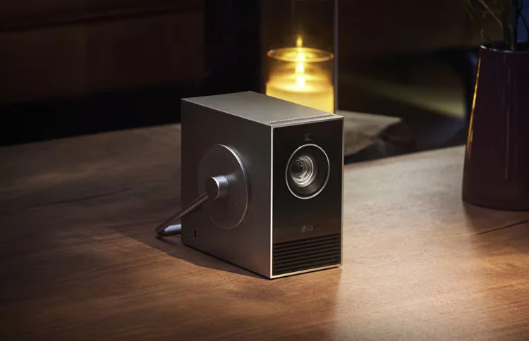 LG's Lifestyle Projector placed on a wooden table