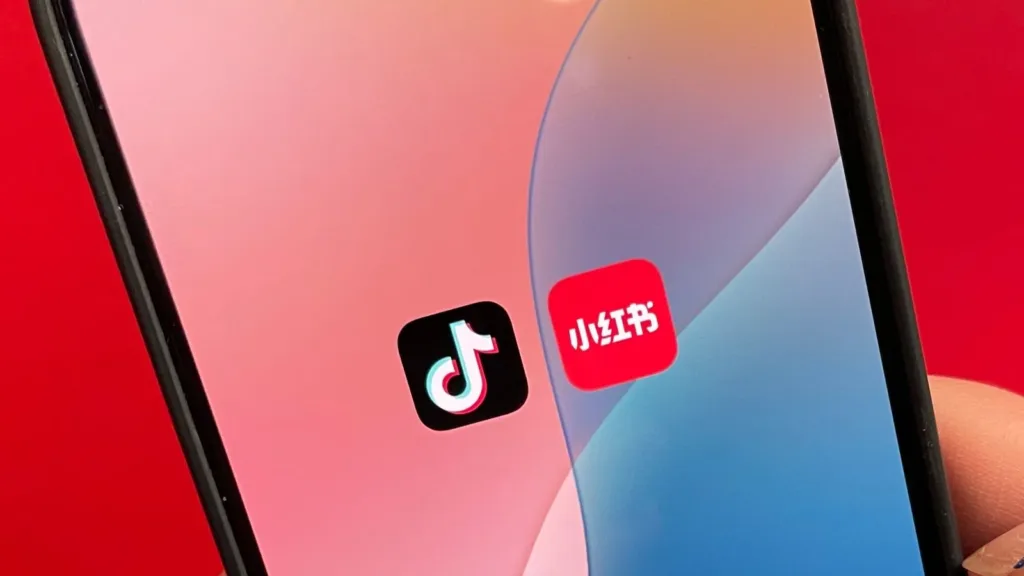 tiktok and rednote logo ina phone screen