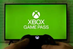 Xbox Game Pass text with green screen on tv